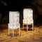 Glitzhome® 14.25" White Metal Cutout Leaves Pattern Solar Powered LED Outdoor Lanterns, 2ct.